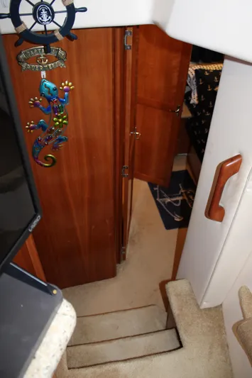  Yacht Photos Pics Interior stairs of 2002 Carver 356 Motor Yacht with nautical decor.