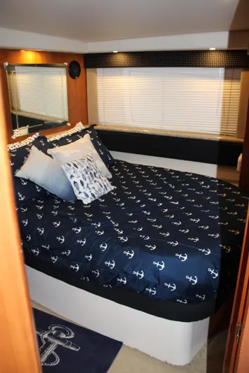  Yacht Photos Pics Luxurious bedroom in 2002 Carver 356 Motor Yacht with nautical-themed bedding.
