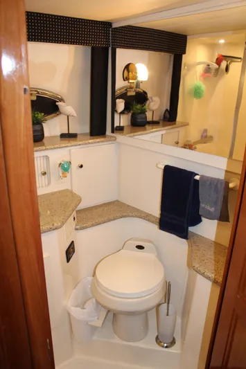  Yacht Photos Pics Bathroom interior of 2002 Carver 356 Motor Yacht with modern amenities and decor.