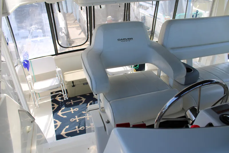  Yacht Photos Pics Interior of 2002 Carver 356 Motor Yacht with white seating and nautical decor.