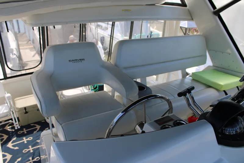  Yacht Photos Pics Interior of 2002 Carver 356 Motor Yacht with helm and seating area.