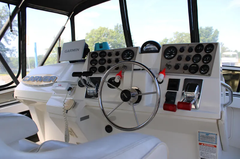  Yacht Photos Pics Helm of 2002 Carver 356 Motor Yacht with Garmin navigation system and control panel.
