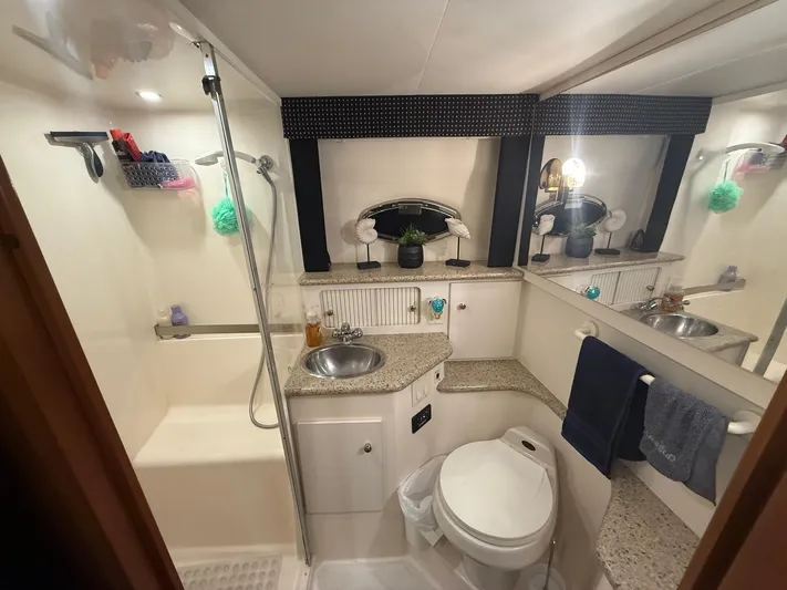  Yacht Photos Pics Luxurious bathroom in 2002 Carver 356 Motor Yacht with modern amenities and elegant design.