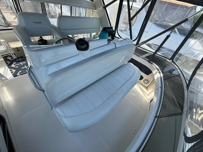  Yacht Photos Pics 2002 Carver 356 Motor Yacht interior with white seating and helm station.