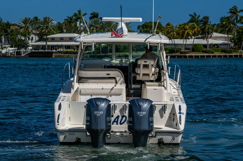  Yacht Photos Pics 2014 Pursuit 345os boat with dual engines on a sunny day.