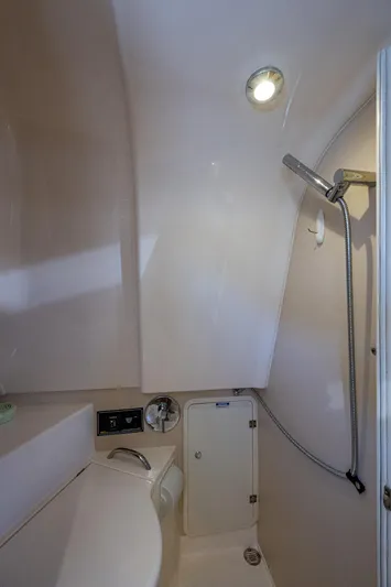  Yacht Photos Pics 2014 Pursuit 345os boat bathroom with showerhead and compact design.