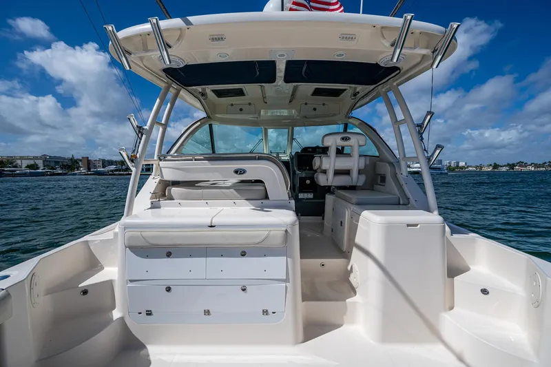  Yacht Photos Pics 2014 Pursuit 345os boat interior with seating, storage, and ocean view.