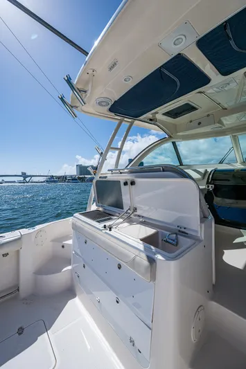  Yacht Photos Pics 2014 Pursuit 345os boat interior with open deck and ocean view.
