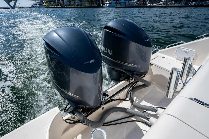  Yacht Photos Pics Twin Yamaha outboard engines on a 2014 Pursuit 345os boat cruising on water.