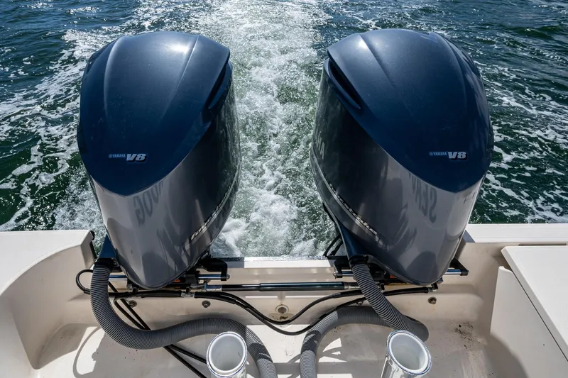  Yacht Photos Pics 2014 Pursuit 345os boat with twin Yamaha V8 engines on water.