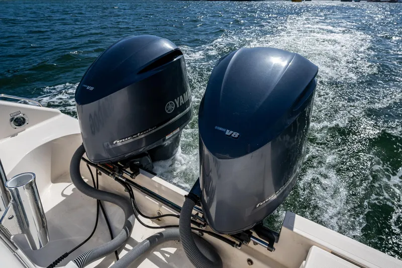  Yacht Photos Pics Twin Yamaha outboard engines on a 2014 Pursuit 345os boat, cruising on water.