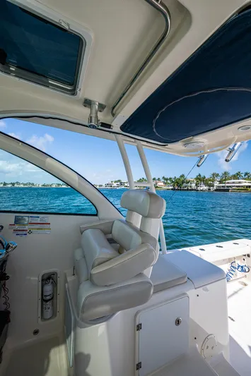  Yacht Photos Pics 2014 Pursuit 345os boat interior with ocean view and comfortable seating.