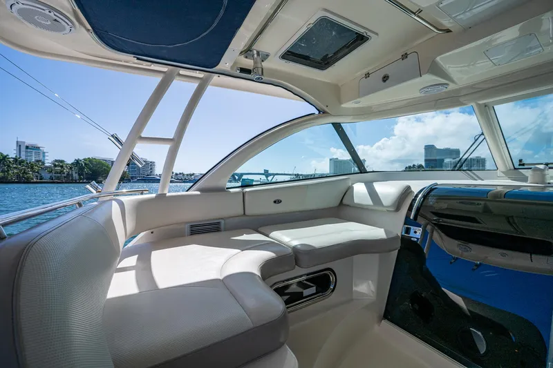  Yacht Photos Pics Interior view of 2014 Pursuit 345os boat, featuring spacious seating and modern design.