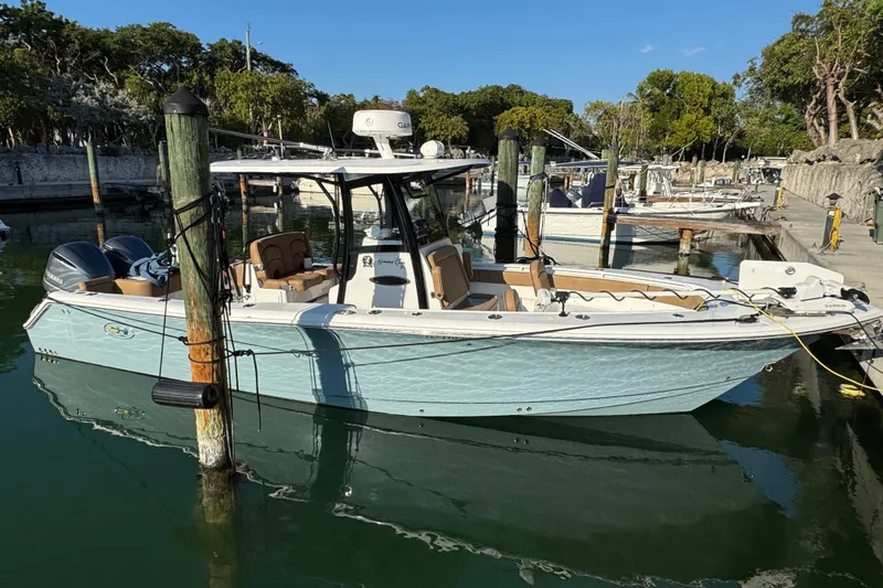  Yacht Photos Pics 2021 Sea Hunt Gamefish 30 Forward Seating boat docked in a marina.