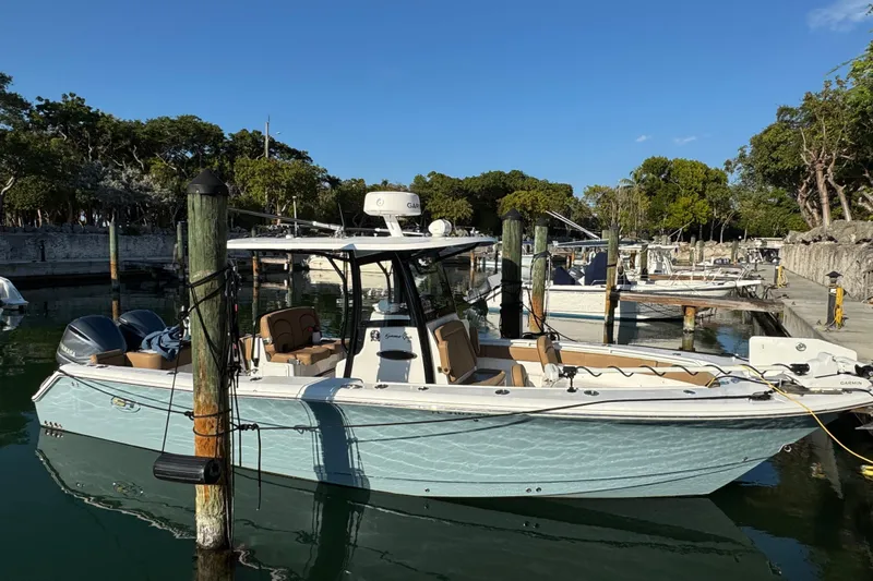  Yacht Photos Pics 2021 Sea Hunt Gamefish 30 boat docked in a serene marina setting.