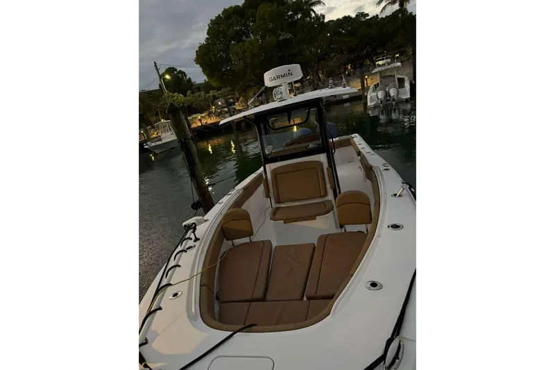  Yacht Photos Pics 2021 Sea Hunt Gamefish 30 Forward Seating boat docked at marina during evening.
