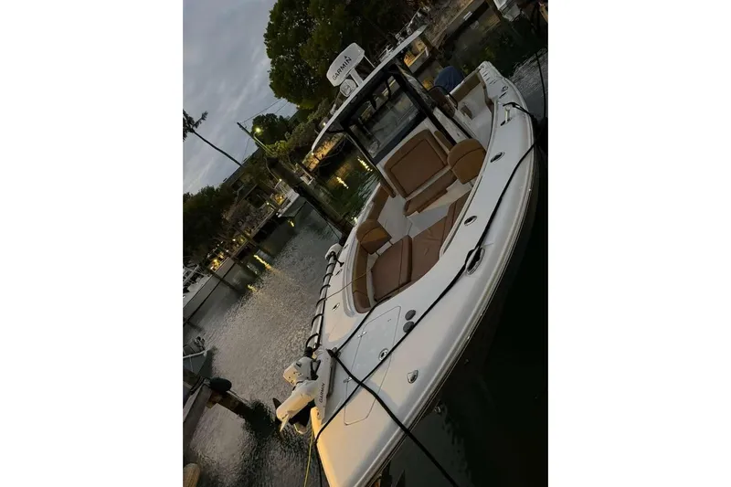  Yacht Photos Pics 2021 Sea Hunt Gamefish 30 boat docked, featuring forward seating and sleek design.