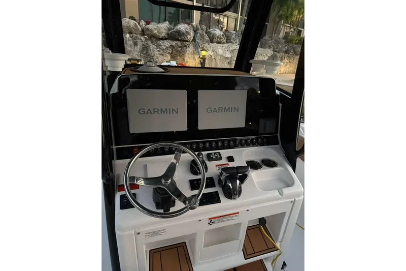  Yacht Photos Pics 2021 Sea Hunt Gamefish 30 helm with dual Garmin displays and modern controls.