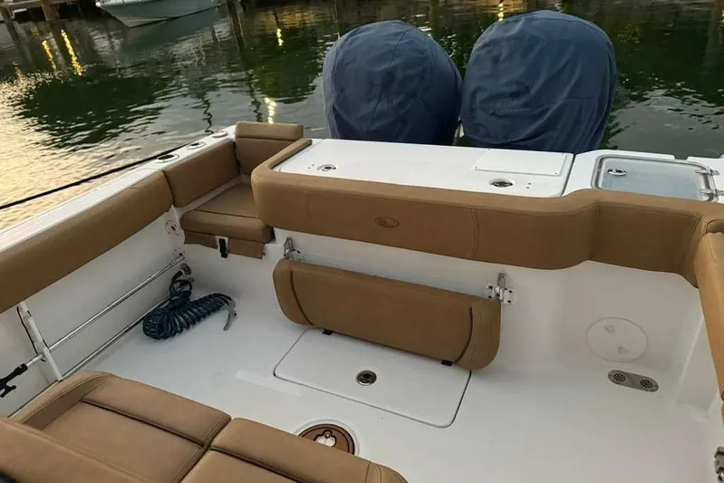  Yacht Photos Pics 2021 Sea Hunt Gamefish 30 boat with tan seating and dual engines.