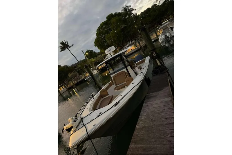  Yacht Photos Pics 2021 Sea Hunt Gamefish 30 Forward Seating boat docked at sunset.