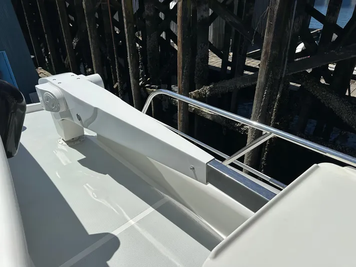 Safari Yacht Photos Pics 2001 Symbol 66 Pilothouse Yacht deck with railing and davit arm.