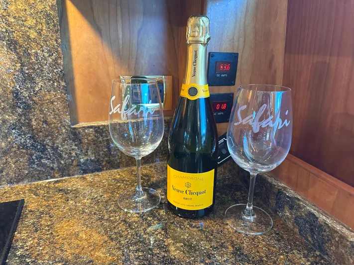 Safari Yacht Photos Pics Champagne bottle with glasses on Symbol 66 Pilothouse Yacht, 2001 model.