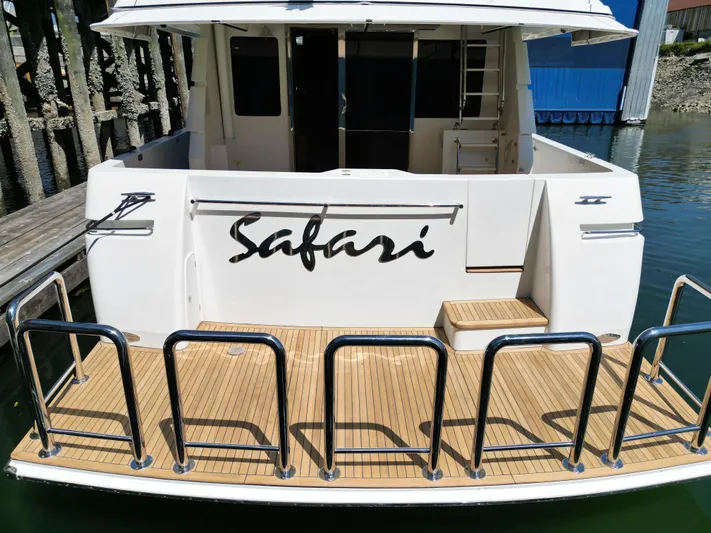 Safari Yacht Photos Pics 2001 Symbol 66 Pilothouse Yacht "Safari" with teak deck at marina.