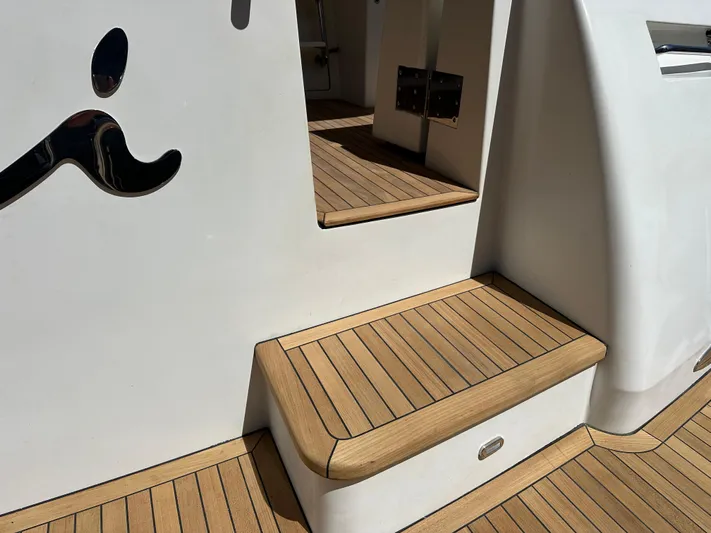 Safari Yacht Photos Pics Steps on a 2001 Symbol 66 Pilothouse Yacht with teak decking.