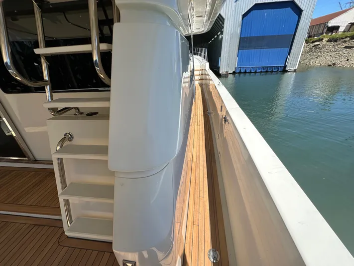 Safari Yacht Photos Pics Side deck view of 2001 Symbol 66 Pilothouse Yacht with wooden flooring.