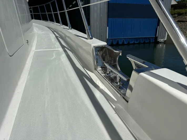 Safari Yacht Photos Pics Side deck of a 2001 Symbol 66 Pilothouse Yacht with stainless steel fittings.