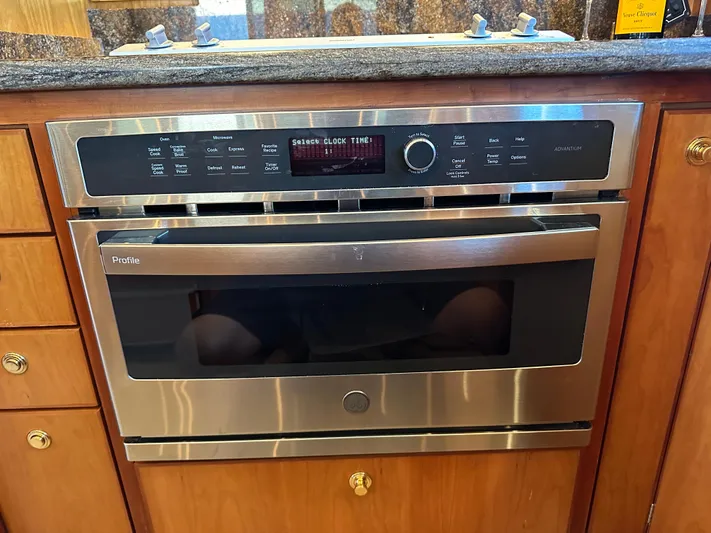 Safari Yacht Photos Pics Stainless steel oven in a 2001 Symbol 66 Pilothouse Yacht kitchen.