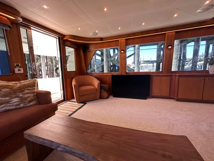 Safari Yacht Photos Pics Luxurious interior of 2001 Symbol 66 Pilothouse Yacht with elegant wood finishes.
