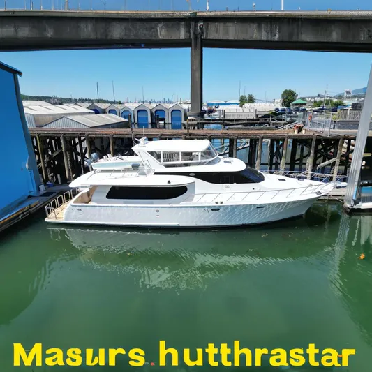 Safari Yacht Photos Pics 2001 Symbol 66 Pilothouse Yacht docked under a bridge on a sunny day.