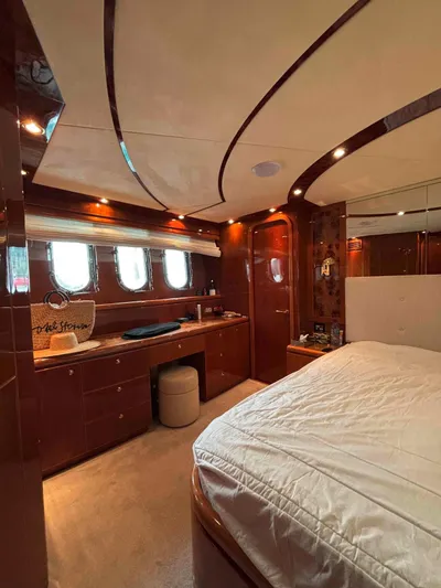  Yacht Photos Pics Luxurious interior of a 2005 Monte Fino 82 yacht with elegant wood finishes.
