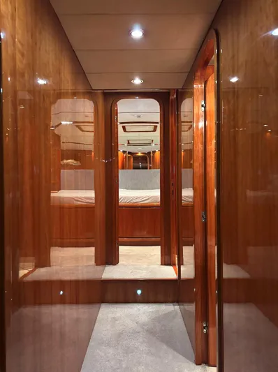  Yacht Photos Pics Luxurious interior of a 2005 Monte Fino 82 yacht with polished wood finishes.