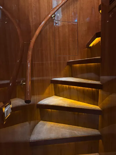  Yacht Photos Pics Luxurious wooden staircase with ambient lighting on a 2005 Monte Fino 82 yacht.