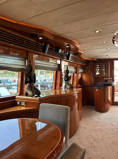  Yacht Photos Pics Luxurious interior of 2005 Monte Fino 82 yacht with elegant wood finishes and decorative accents.