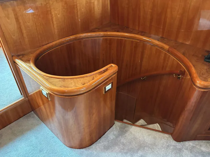  Yacht Photos Pics Curved wooden staircase on a 2005 Monte Fino 82 yacht interior.
