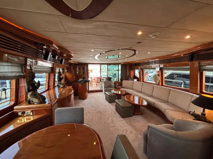  Yacht Photos Pics Luxurious interior of 2005 Monte Fino 82 yacht with elegant seating and wooden accents.