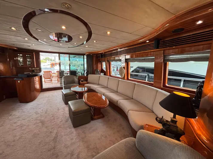  Yacht Photos Pics Luxurious interior of 2005 Monte Fino 82 yacht with elegant seating and wood finishes.