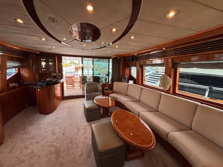  Yacht Photos Pics Luxurious interior of 2005 Monte Fino 82 yacht with elegant seating and wooden accents.