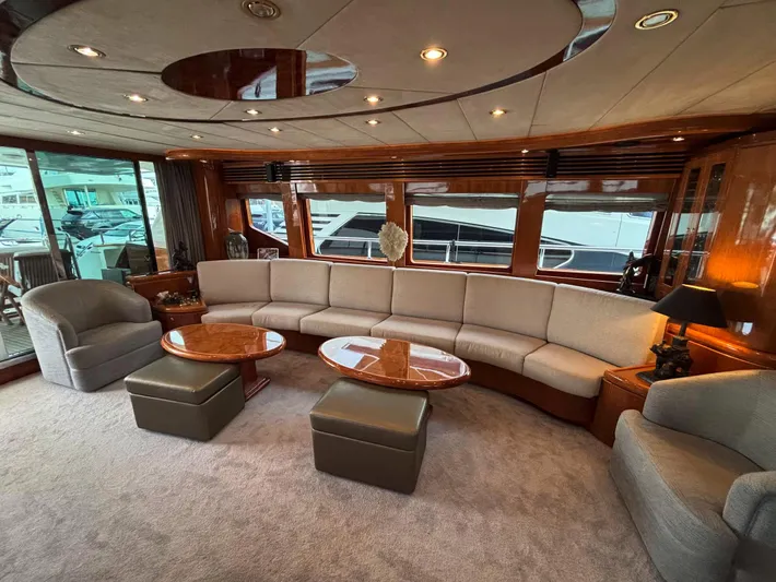  Yacht Photos Pics Luxurious interior of a 2005 Monte Fino 82 yacht with elegant seating and wooden accents.