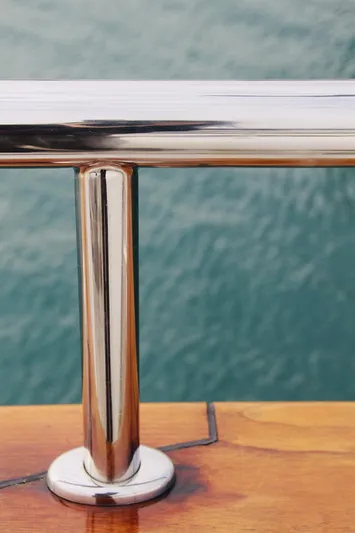  Yacht Photos Pics Polished metal railing on Monte Fino 82 yacht, 2005, with ocean background.