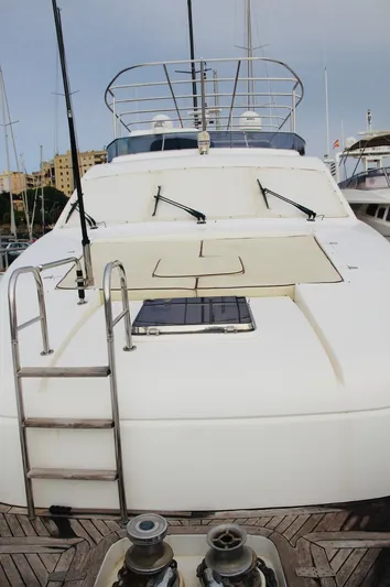  Yacht Photos Pics Monte Fino 82 yacht, 2005 model, docked with visible deck and ladder.