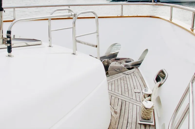  Yacht Photos Pics Monte Fino 82 yacht deck, 2005 model, featuring wooden flooring and stainless steel railings.