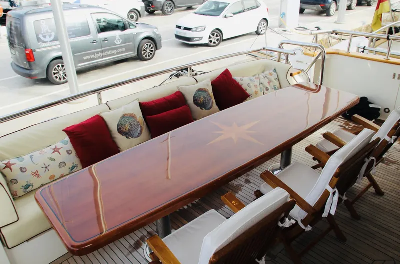  Yacht Photos Pics Luxurious Monte Fino 82 yacht deck with elegant dining area, 2005 model.