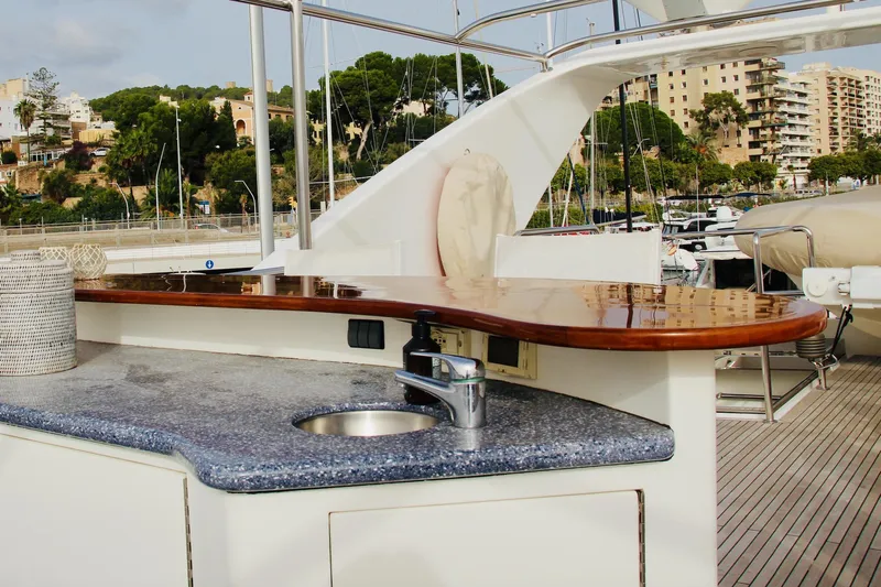  Yacht Photos Pics Luxurious Monte Fino 82 yacht deck with sleek countertop and sink, 2005 model.