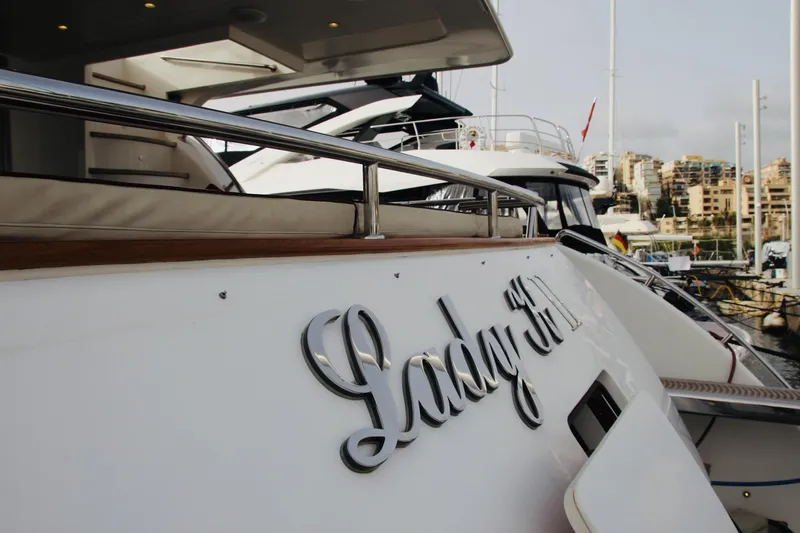  Yacht Photos Pics Monte Fino 82 yacht from 2005 docked at a marina, featuring elegant design.