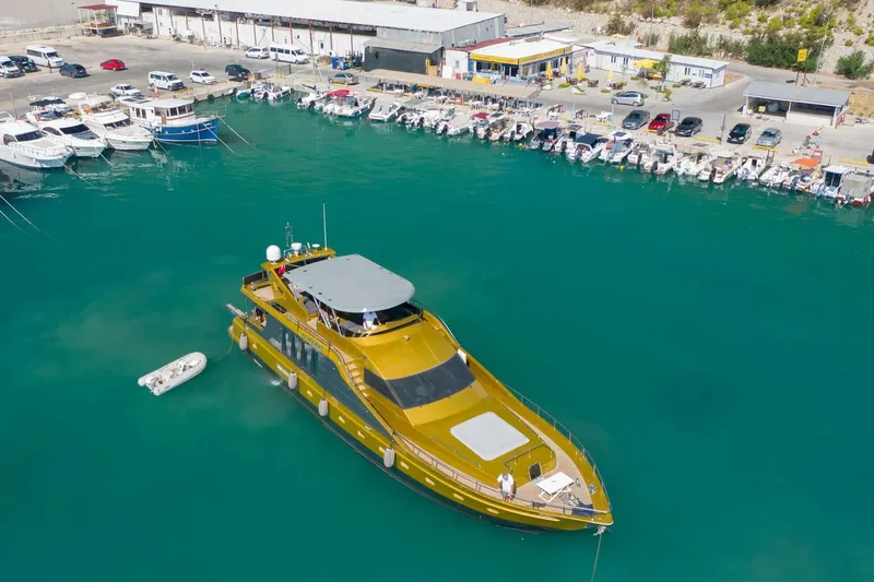  Yacht Photos Pics Luxurious 2007 Custom 85 Motor Yacht docked in a vibrant marina.