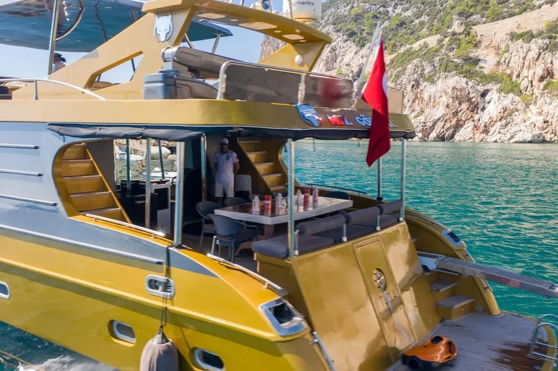  Yacht Photos Pics Luxurious 2007 Custom 85 Motor Yacht cruising near rocky coastline.